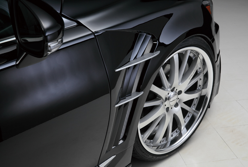 WALD Lexus LS F SPORT sports fender duct with net and aluminium fins beside a WALD wheel