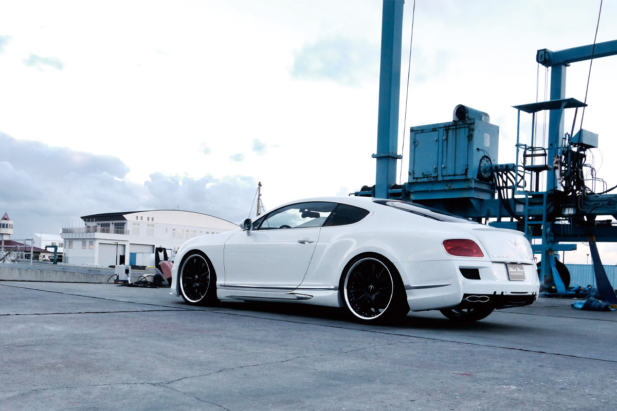 Bentley Continental GT WALD Black Bison Edition rear quarter view with WALD rear bumper spoiler and boot spoiler