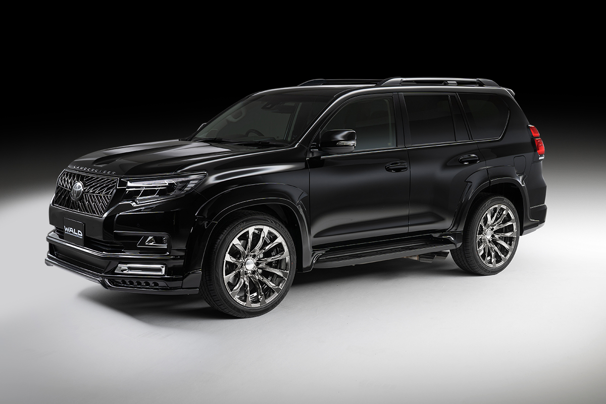 WALD Black Bison Edition Land Cruiser Prado 150 studio front three-quarter view with wide arch package and chrome WALD wheels