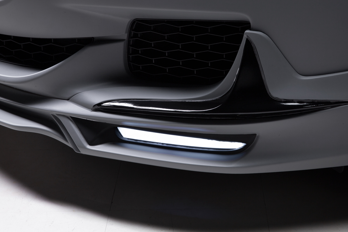 WALD Maserati Quattroporte front spoiler close-up — LED lamp detail on the lower lip