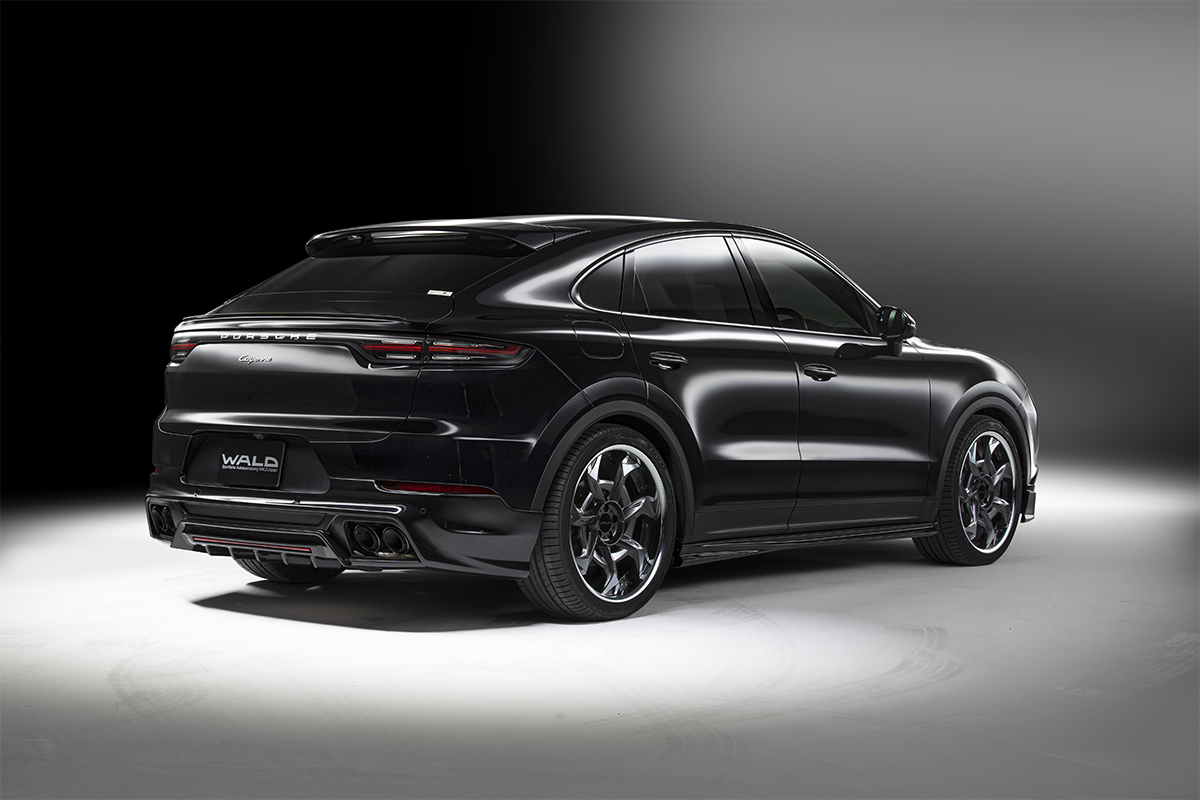 WALD Porsche Cayenne Coupe 9YA body kit — black Cayenne Coupe rear three-quarter studio view with complete Black Bison Edition kit