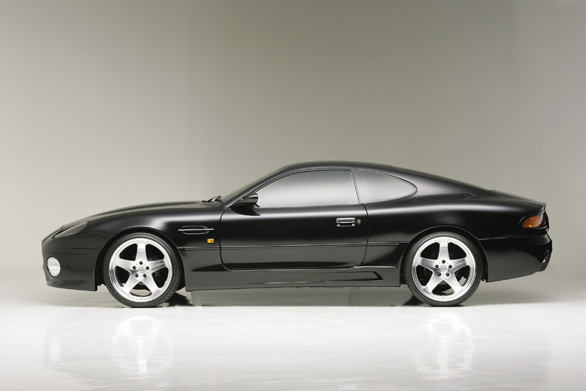 WALD Aston Martin DB7 side skirts — black DB7 side profile with WALD Sports Line side skirts and WALD wheels