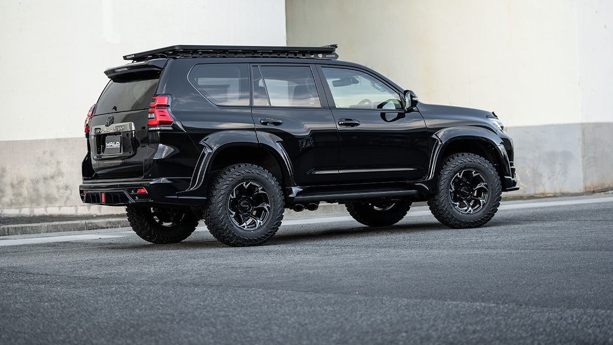 WALD Black Bison Edition Prado 150 rear three-quarter view showing 45mm-per-side wide arch over-fenders and lifted stance