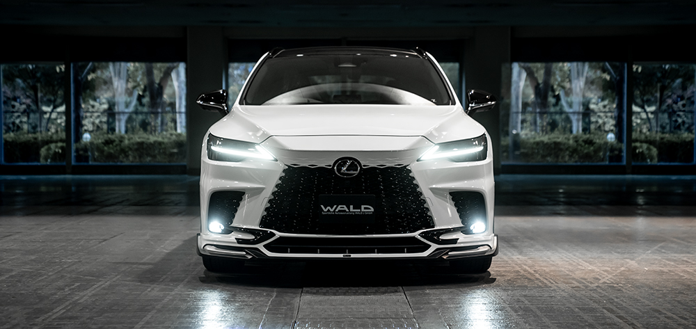 WALD Lexus RX head-on front view — white Lexus RX with WALD half type add-on front spoiler and WALD grille badge