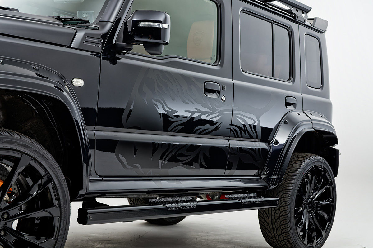 WALD Black Bison Edition Suzuki Jimny Nomade JC74W — side detail showing wide arch fender extensions and WALD side steps