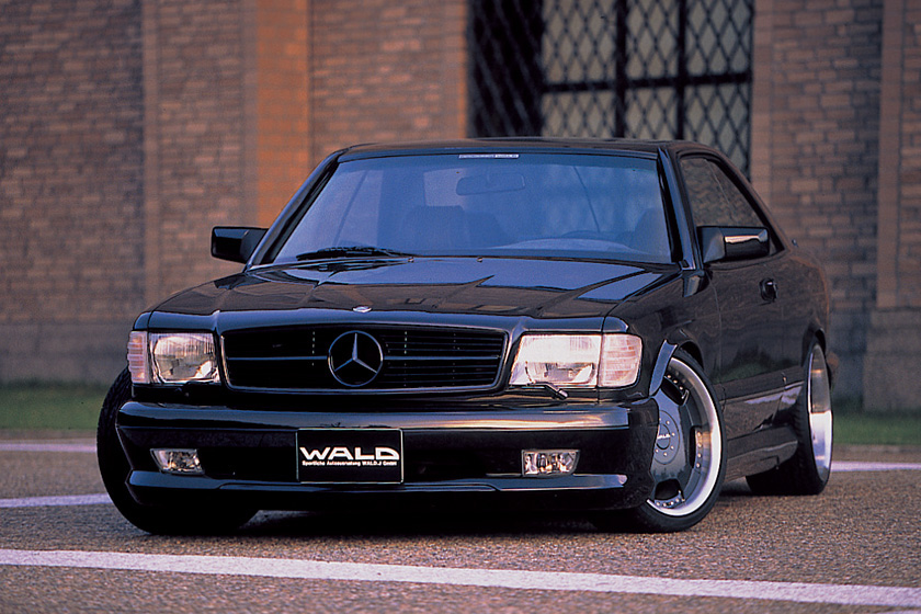 WALD Executive Line Mercedes-Benz CL-Class C126 1980–1991 — black SEC coupé with WALD front spoiler and deep-dish alloy wheels