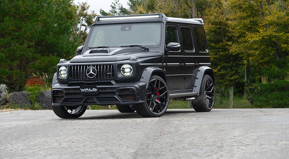 WALD G-Class W463A Black Bison front three-quarter — matte black G63 with wide arch package and front roof spoiler LED bar