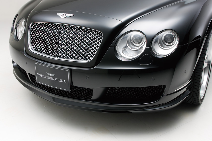 WALD Bentley Flying Spur Executive Line front lip spoiler and headlamp detail on gloss black bodywork