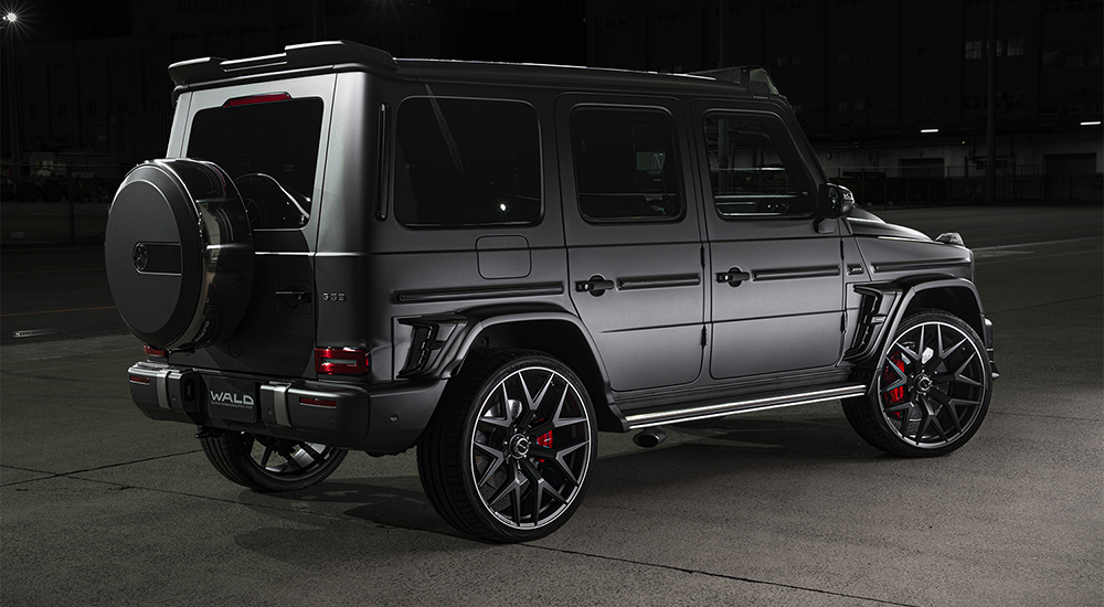 WALD G63 W463A Sports Line rear three-quarter night view with fender duct panels and rear roof spoiler