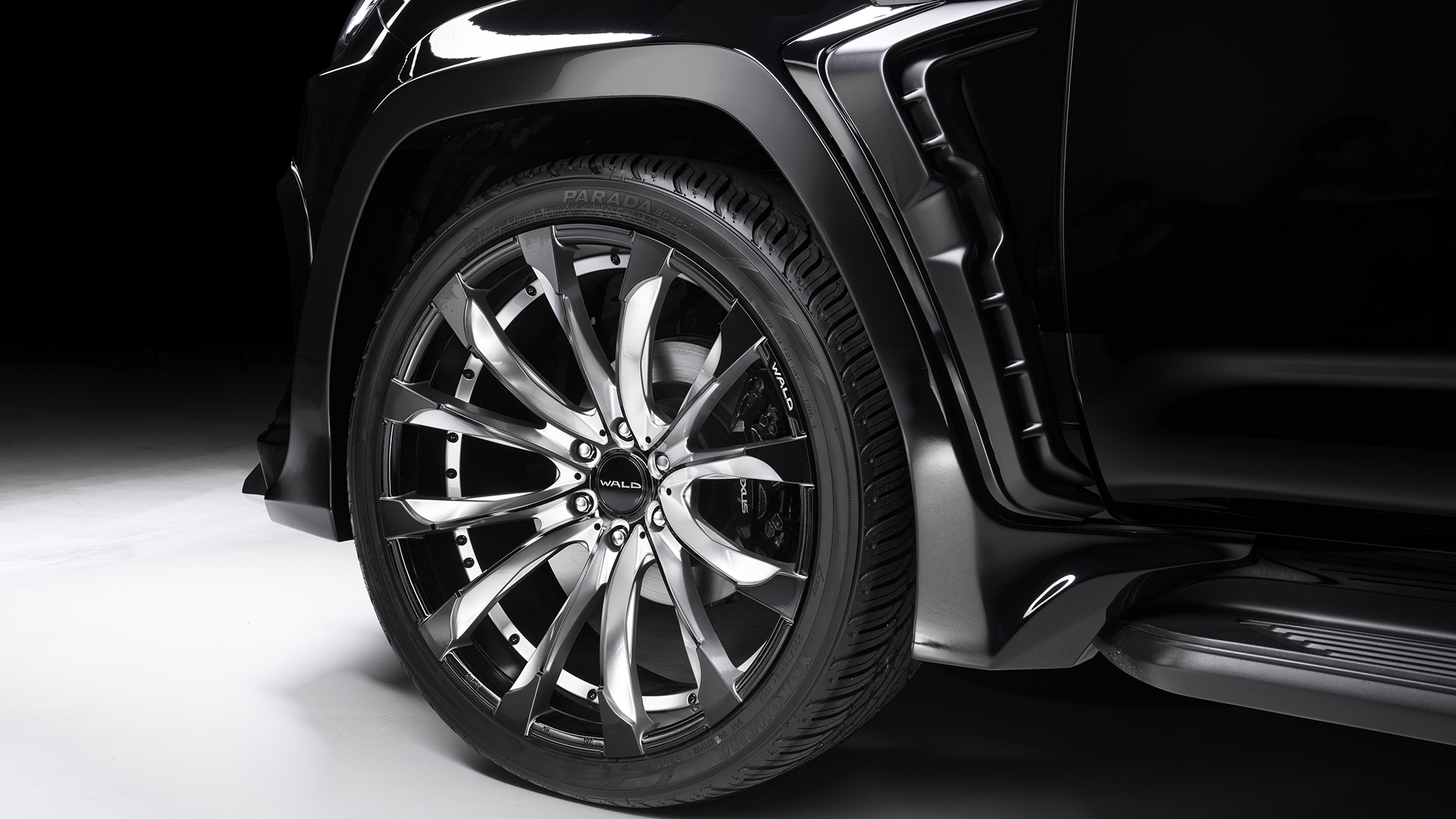WALD Lexus LX600 wheel and wide arch detail — polished WALD 24-inch wheel under the Black Bison over-fender with side step
