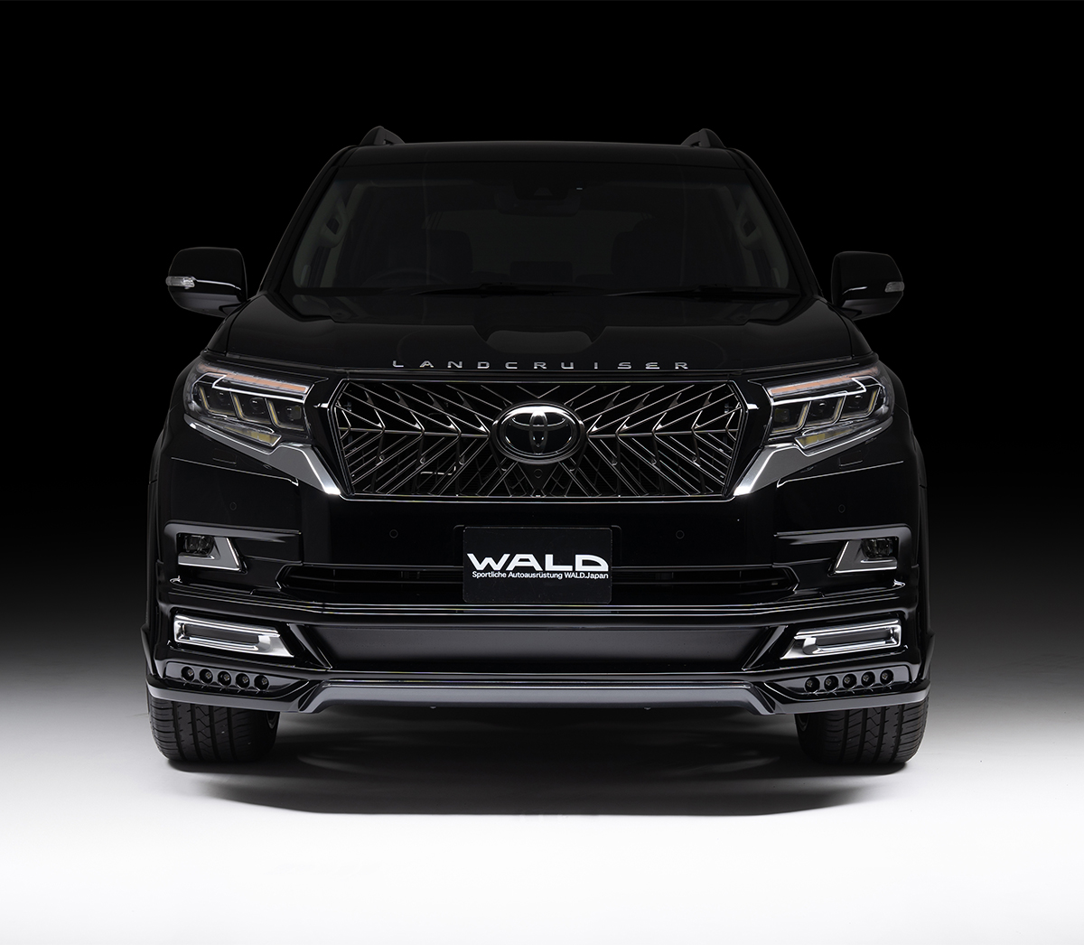 WALD Black Bison Edition Prado 150 head-on front studio view with WALD front grille and front spoiler LED lamps