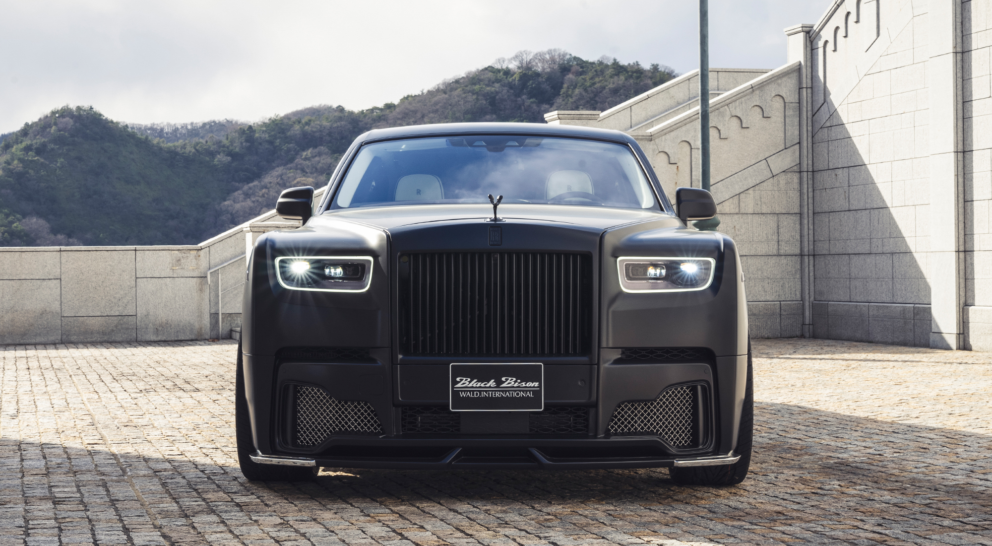 WALD Rolls-Royce Phantom 8 Black Bison — front view with lit headlamps — Premier Auto Design UK and Europe