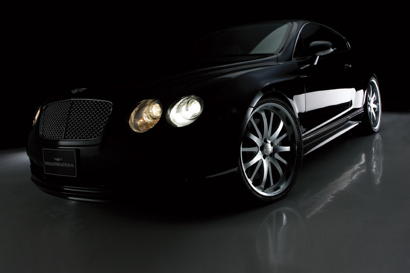 WALD Bentley Continental GT 2003–2007 Executive Line, low-angle front three-quarter in dark studio lighting