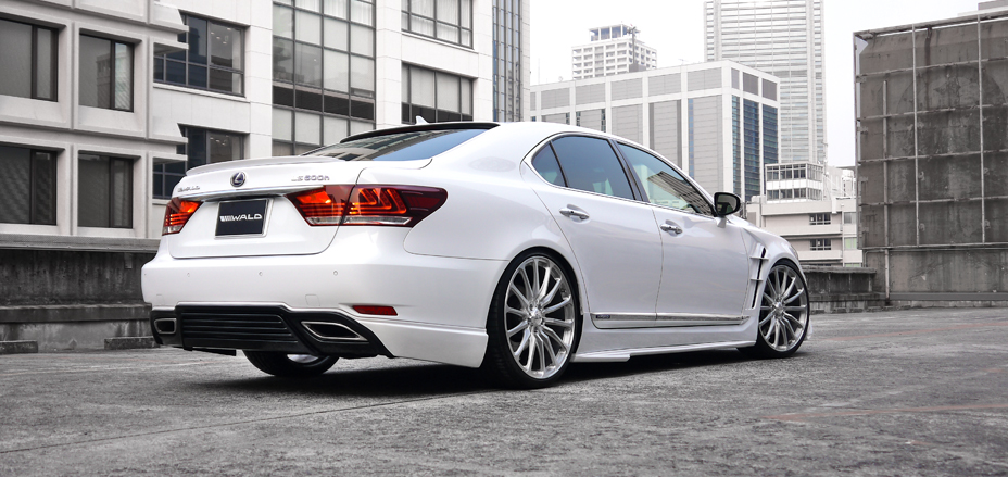 WALD Executive Line Lexus LS600h F SPORT in white rear three-quarter rooftop view with WALD rear skirt and boot spoiler