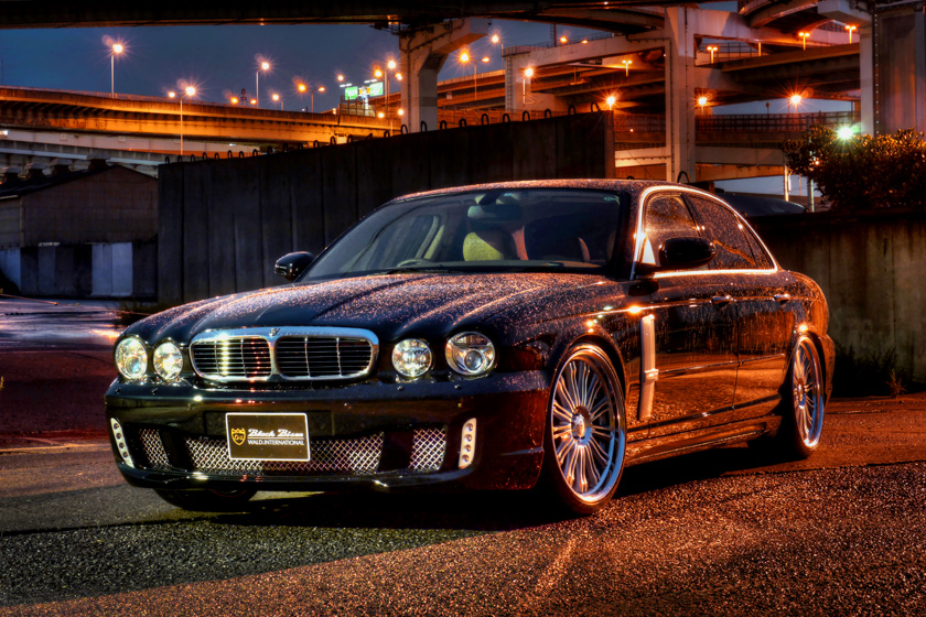 Jaguar XJ X350 WALD Black Bison body kit photographed at night, front three-quarter view