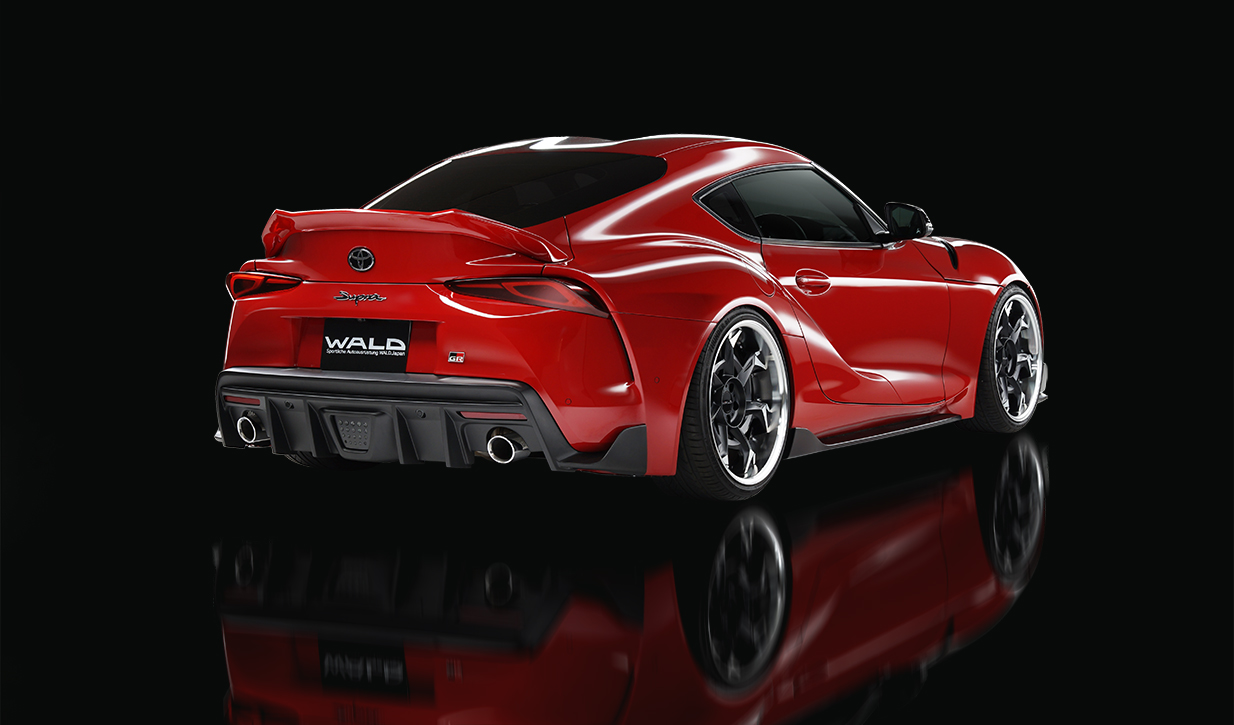WALD Sports Line Toyota Supra rear three-quarter studio view with rear diffuser and stainless exhaust tips