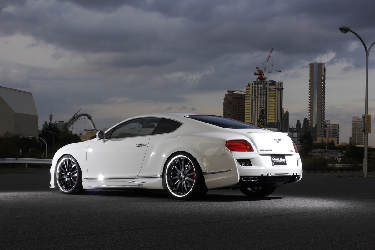 Bentley Continental GT WALD Black Bison Edition rear three-quarter view with WALD rear bumper spoiler and quad exhaust tips