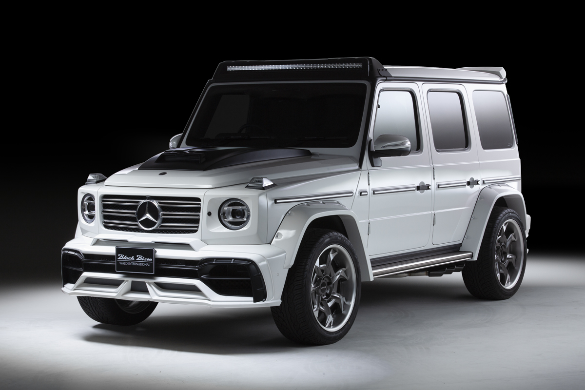WALD Mercedes G-Class W463A Black Bison front three-quarter studio view — white G-Class with wide arch package and WALD wheels