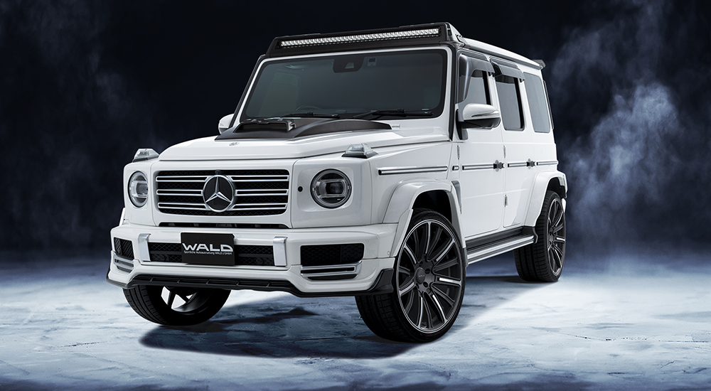WALD Sports Line Mercedes G-Class W463A G550 front three-quarter with LED roof bar, bonnet scoop cover and fender duct panels