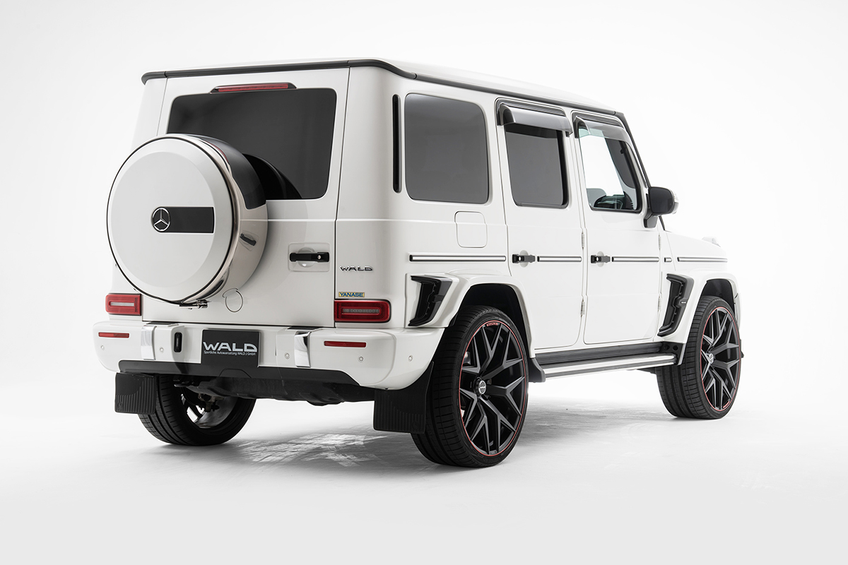 WALD Sports Line Mercedes G-Class W463A rear three-quarter studio view — white G550 with ABS rear roof spoiler and fender duct panels