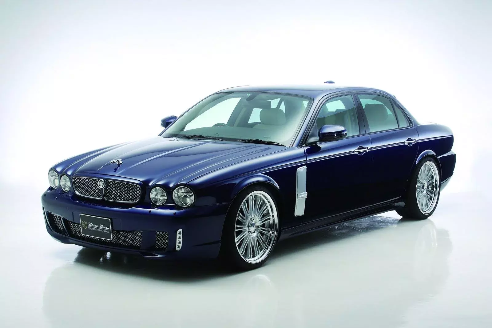 WALD Black Bison Jaguar XJ X350 studio front three-quarter view on multi-spoke WALD wheels