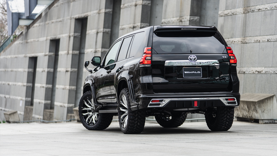 Black WALD Sports Line Prado 150 rear three-quarter view showing rear skirt and over-fenders