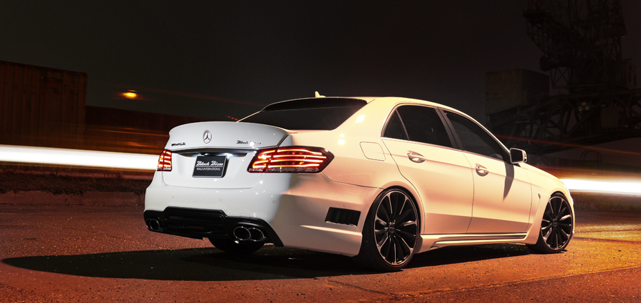 Mercedes-Benz E-Class W212 WALD Black Bison rear three-quarter view with rear bumper spoiler and twin exhaust tips