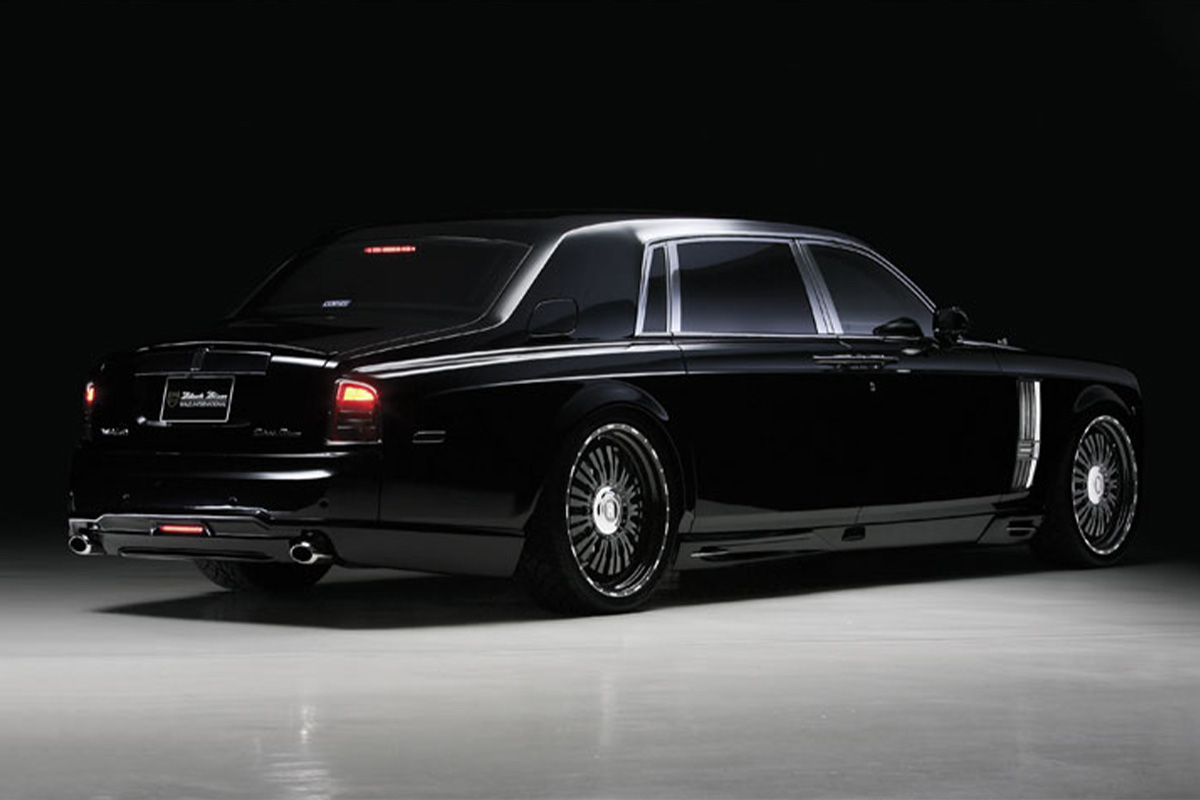 Black Rolls-Royce Phantom WALD Black Bison rear three-quarter view on RENOVATIO 1 RR forged wheels