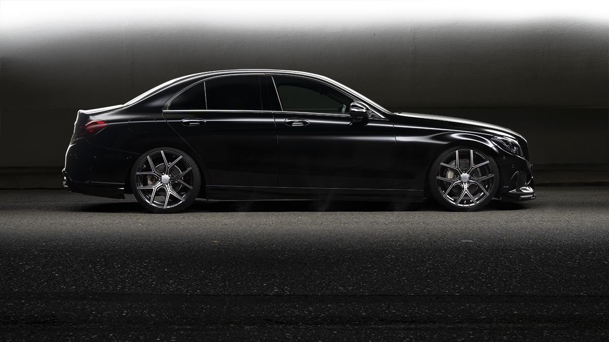 Black Mercedes-Benz C-Class side profile on WALD ILLIMA I11C wheels