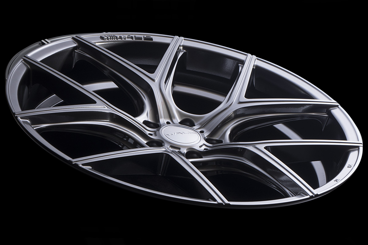 WALD ILLIMA I11C 1-piece wheel in Hyper Silver photographed at a low angle against black
