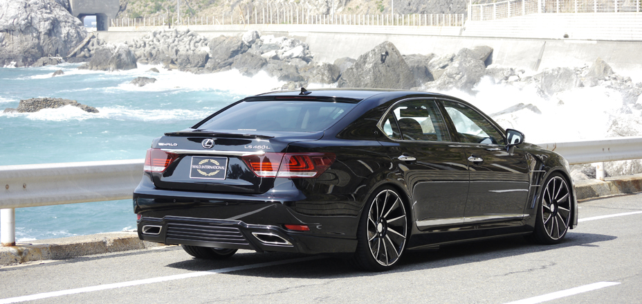 WALD Executive Line Lexus LS460L rear three-quarter coastal view with WALD rear skirt and boot spoiler