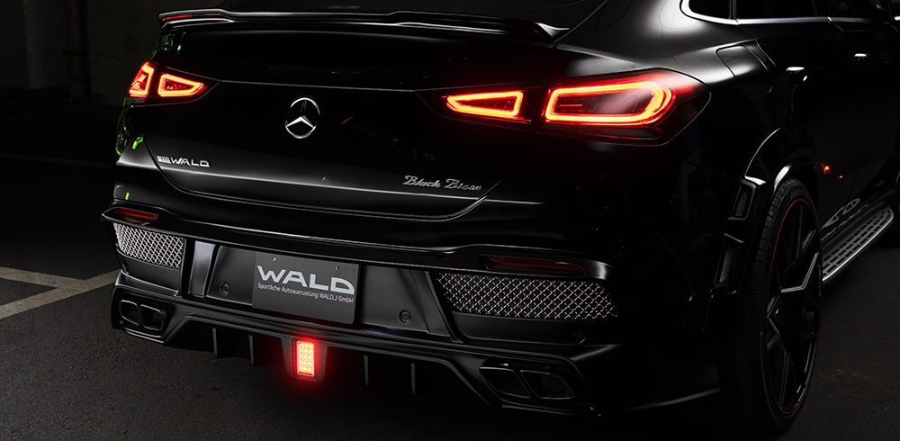 WALD Black Bison GLE Coupe C167 rear skirt detail with illuminated LED brake lamp and trapezoid-shaped exhaust tips