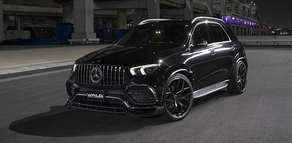 WALD Black Bison Mercedes GLE W167 AMG Line front three-quarter view at night with wide arch package and front spoiler