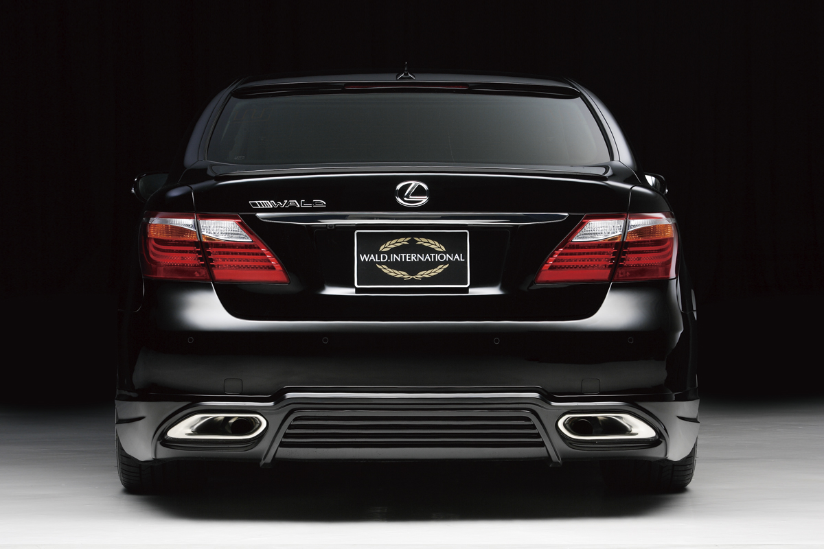 WALD Executive Line Lexus LS460L rear studio view with WALD rear skirt, roof spoiler and stainless steel exhaust finishers