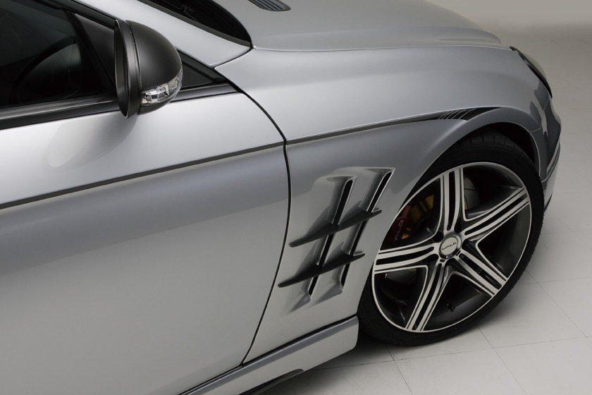WALD Sports Line Mercedes-Benz CLS-Class C219 sports fender duct detail with aluminium fins and multi-spoke WALD wheel
