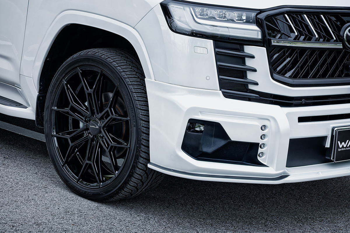 WALD ELDORANTE E11C wheel in Gloss Black on a white Toyota Land Cruiser LC300 — front wing and bumper detail