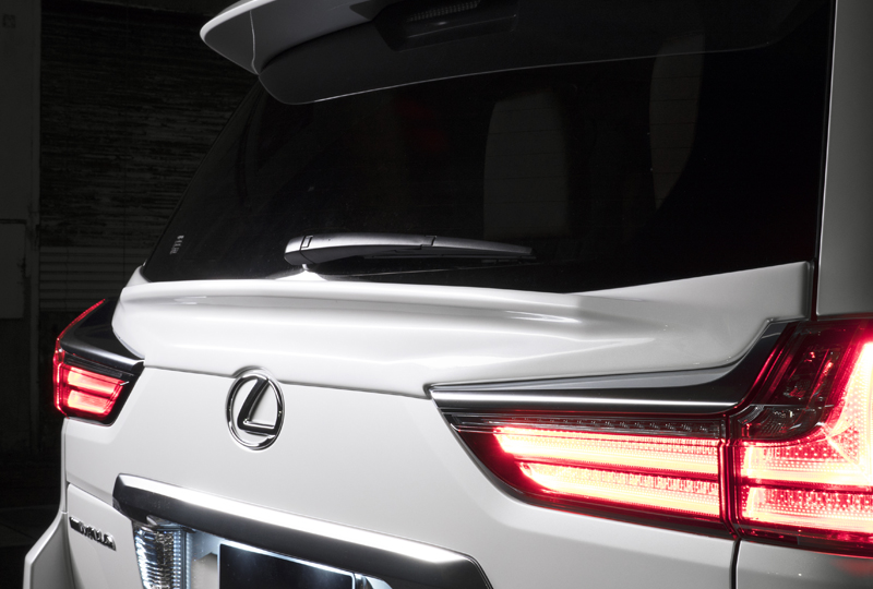 WALD Lexus LX570 rear tailgate spoiler detail on a white LX570 at night