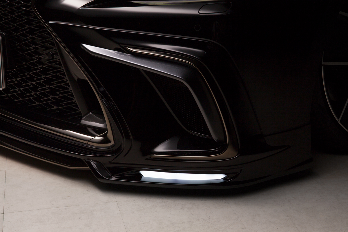 WALD Lexus LS500 F SPORT front spoiler corner detail with illuminated LED lamp and duct cover