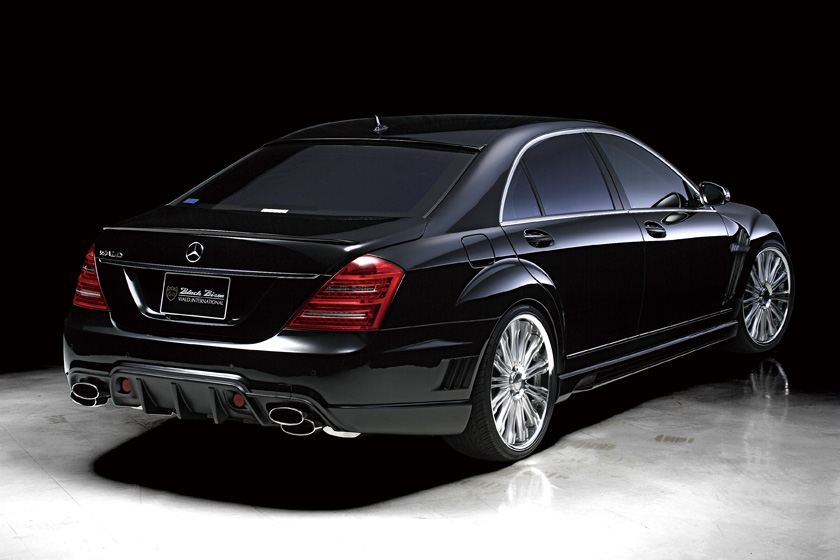 Mercedes W221 Black Bison Edition rear three-quarter studio view with rear bumper spoiler and quad exhaust tips