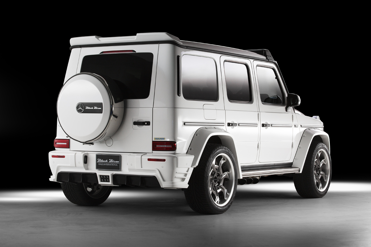 WALD Black Bison Mercedes G-Class W463A rear three-quarter — white G-Class with rear skirt, rear roof spoiler and Black Bison spare wheel cover