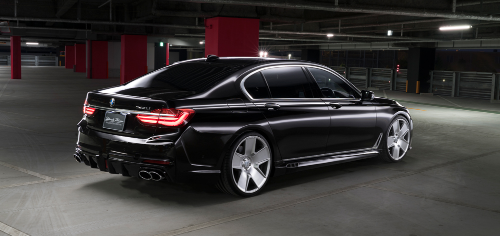 WALD BMW 7 Series G12 Black Bison black 740Li rear three-quarter view with WALD side skirts and forged wheels