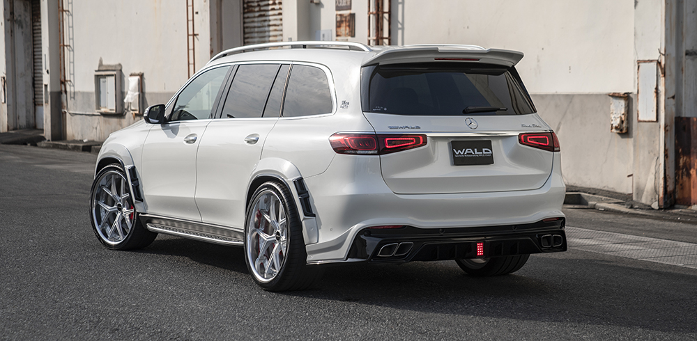 WALD Black Bison Mercedes GLS X167 rear three-quarter view on location with rear wing and diffuser-shaped rear skirt