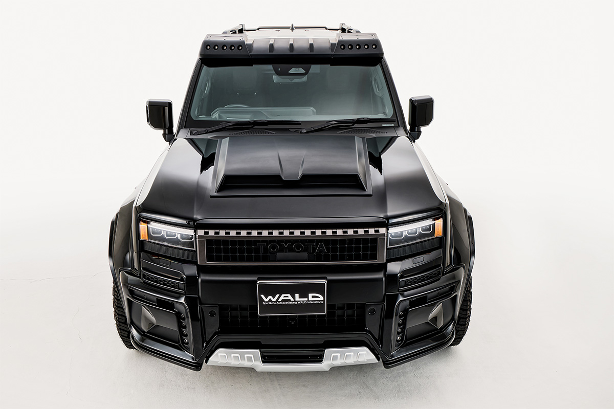 WALD Black Bison Land Cruiser 250 Prado elevated front view with roof LED lamp bar, bonnet scoop and wide arch package