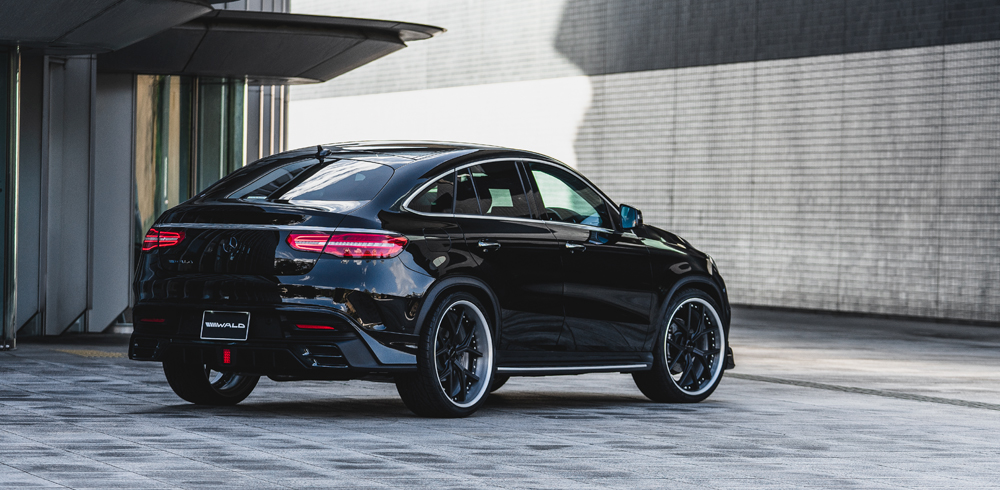 WALD Sports Line Mercedes GLE Coupe C292 AMG Line rear three-quarter on location with rear skirt and forged wheels