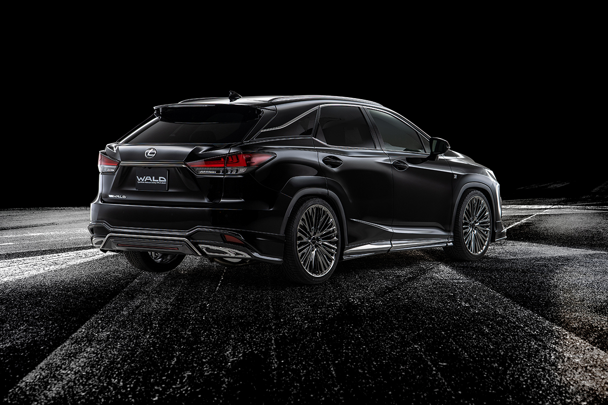 WALD Sports Line Lexus RX300 rear three-quarter — black Lexus RX300 F SPORT with WALD rear skirt and chrome garnish