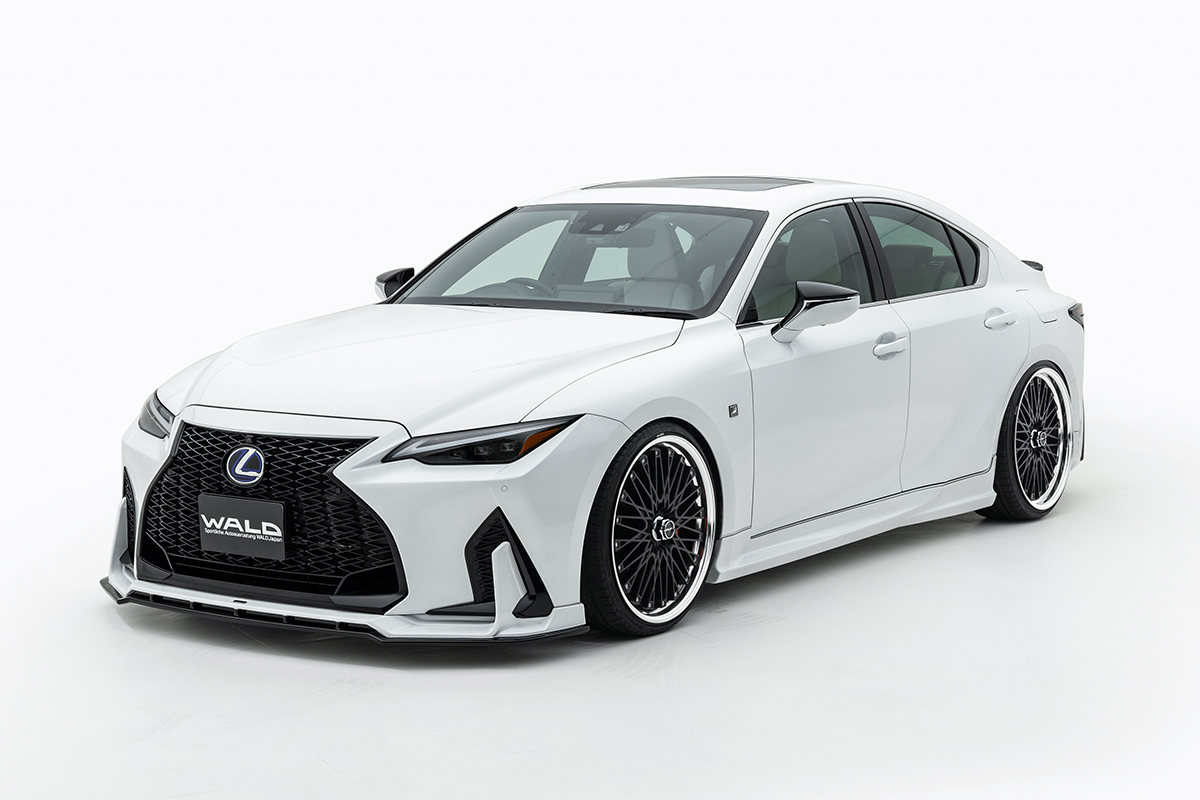 WALD Sports Line Lexus IS body kit — white Lexus IS F SPORT front three-quarter studio view with WALD front spoiler and side skirts