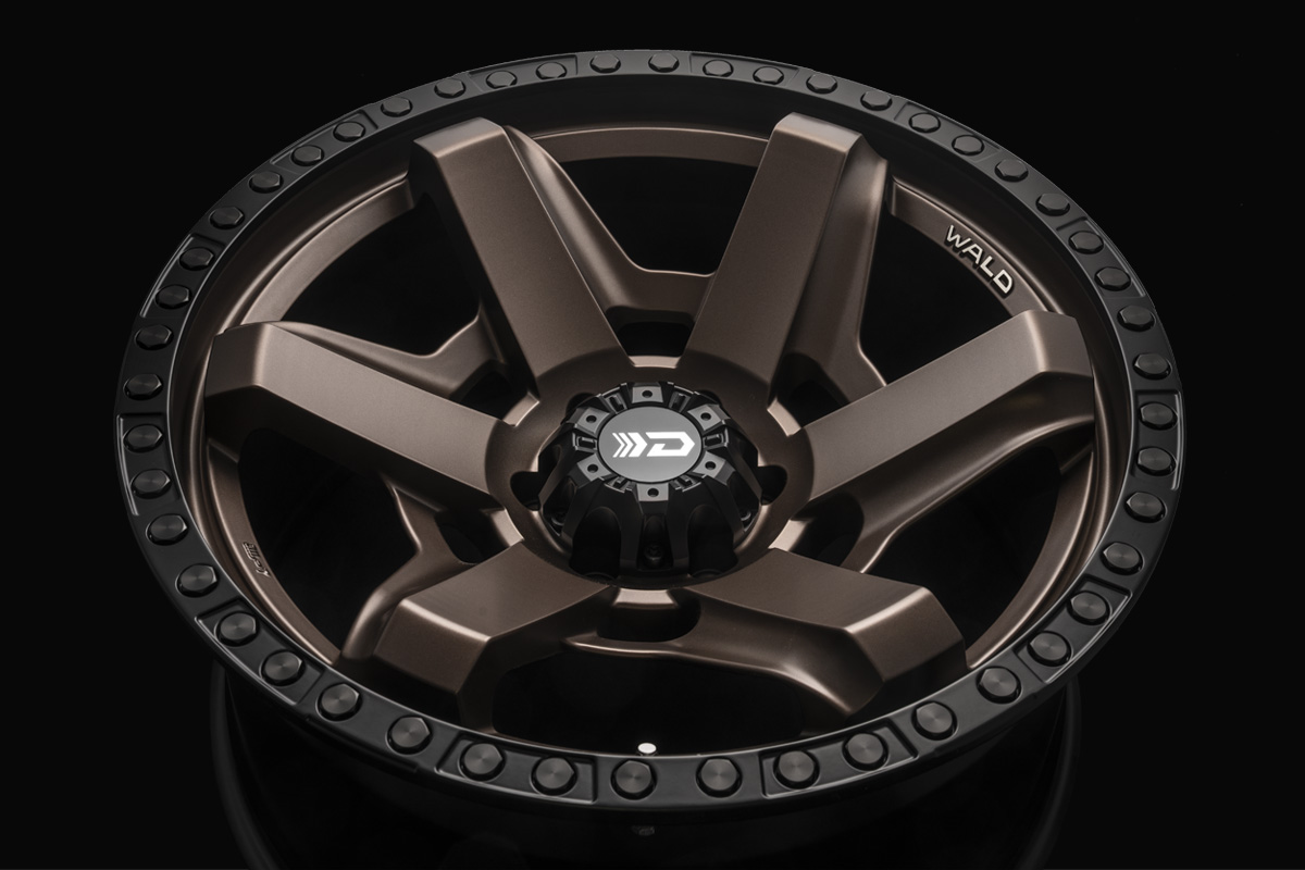 WALD Desert Line DS001 wheel face showing the six-spoke armoured-inspired design