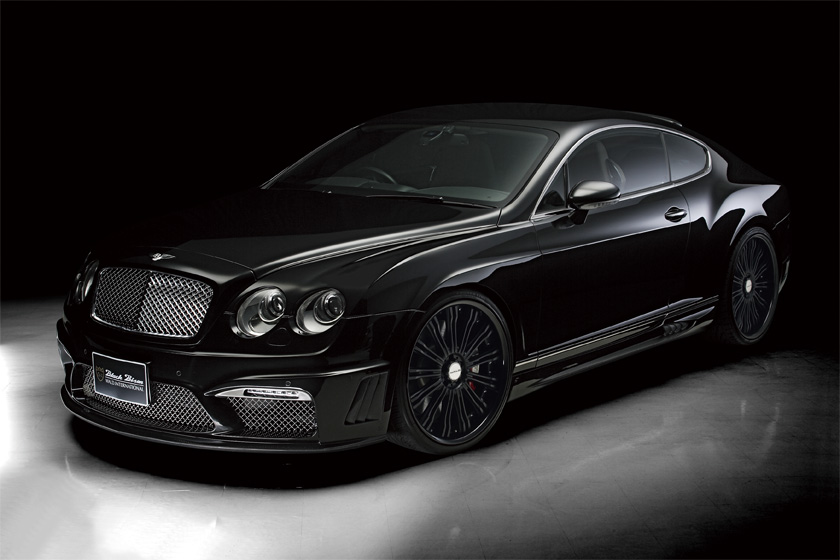 Bentley Continental GT WALD Black Bison body kit UK — black coupe front three-quarter studio view with WALD side skirts and multi-spoke wheels