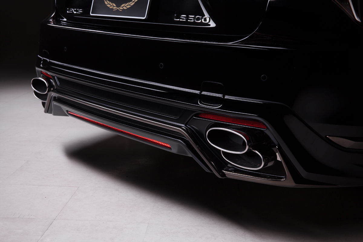 WALD Lexus LS500 F SPORT Turbo rear skirt close-up with smoked chrome garnish and oval exhaust tips