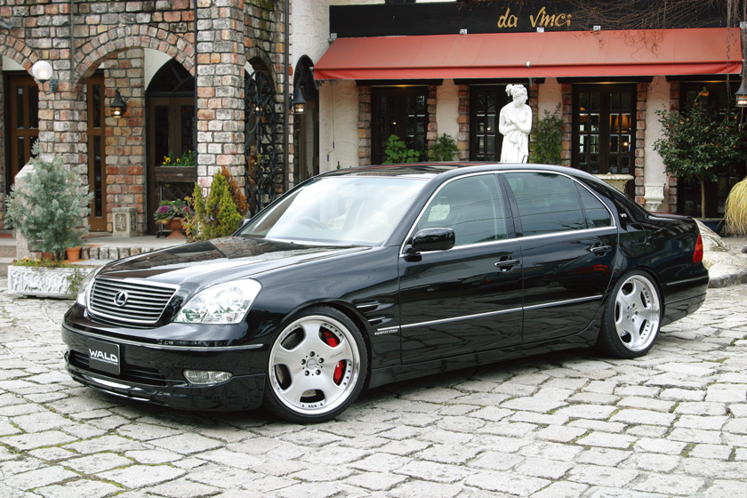 WALD Executive Line Toyota Celsior UCF30/31 M/C before — black Celsior on cobblestone street with WALD body kit and forged wheels